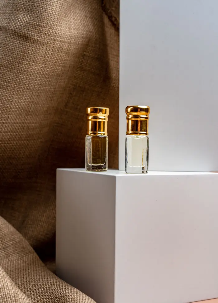 Two small perfume-oil bottles