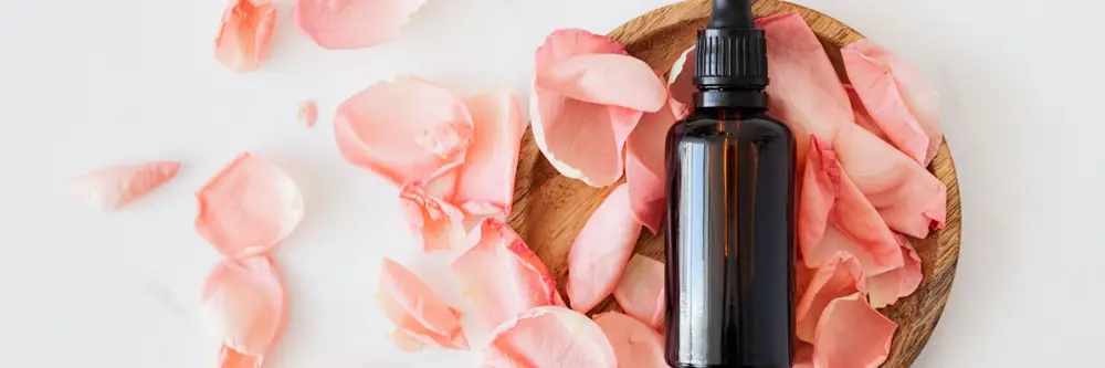 Rose petals and a dropper bottle