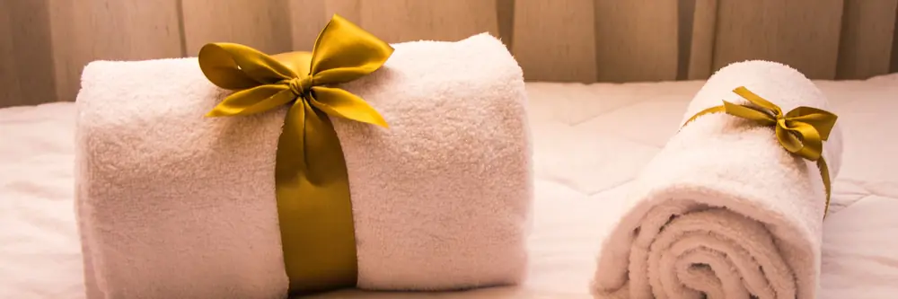 Rolled towels tied with ribbon