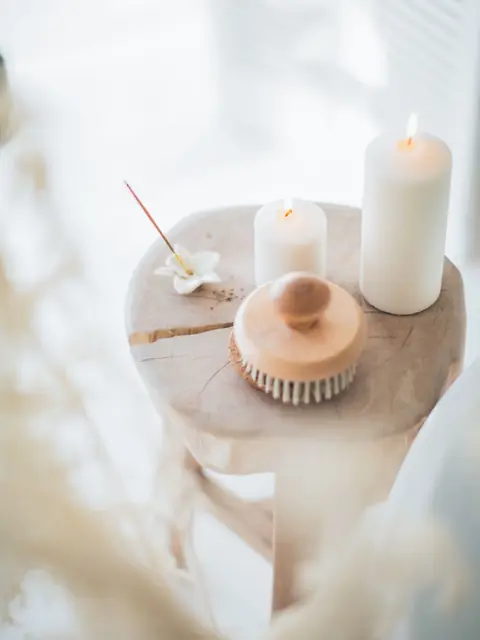 Candles and a bath brush